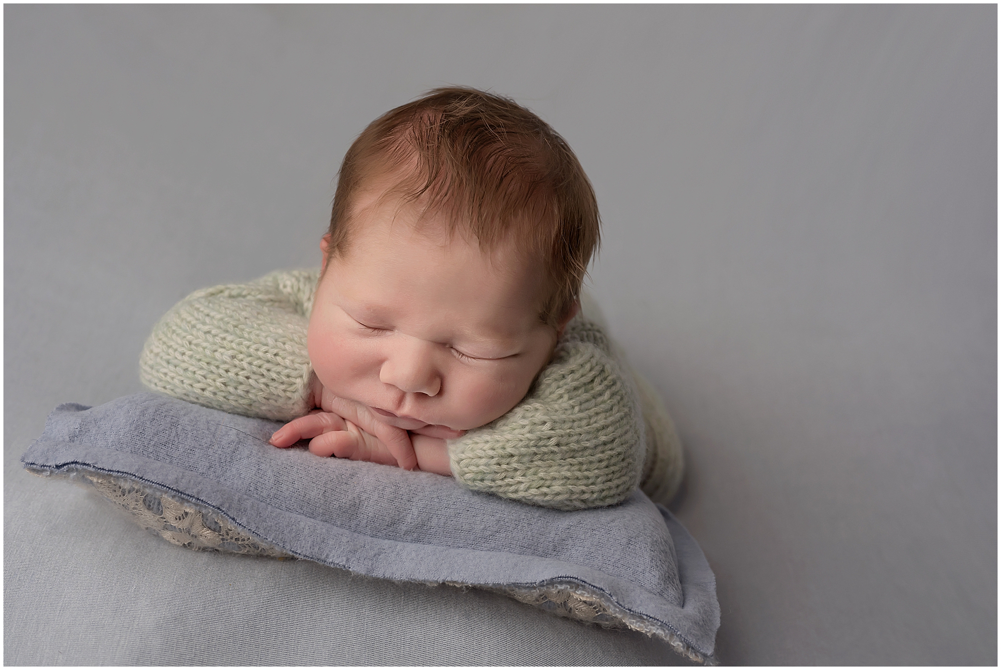 newborn baby sleeping on pillow in london ontario studio