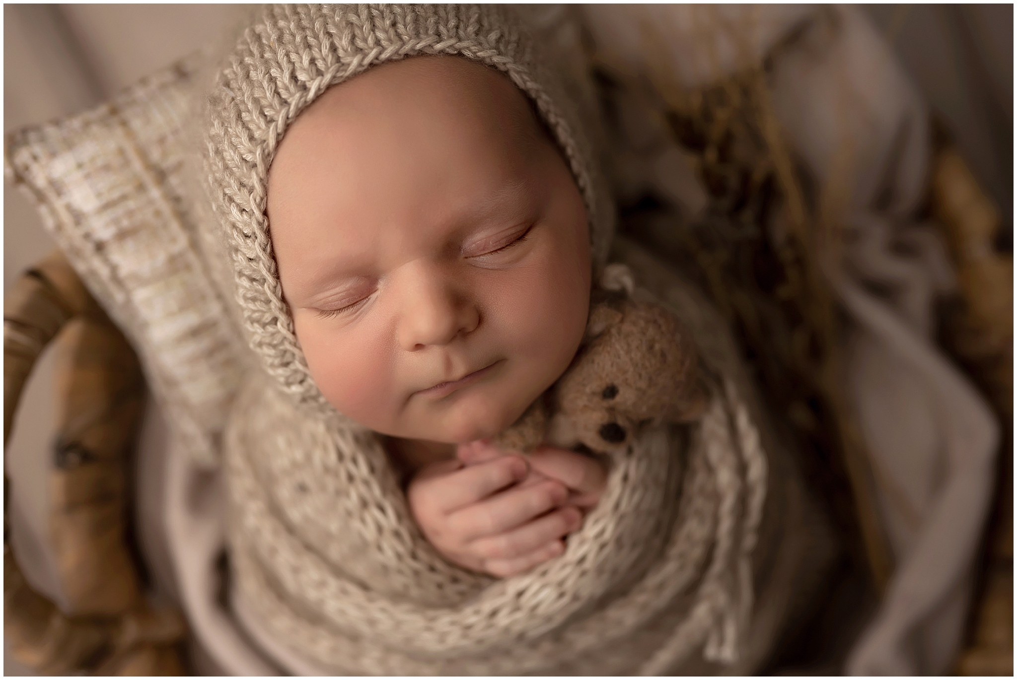 baby boy sleeping during newborn photography session in london ontario
