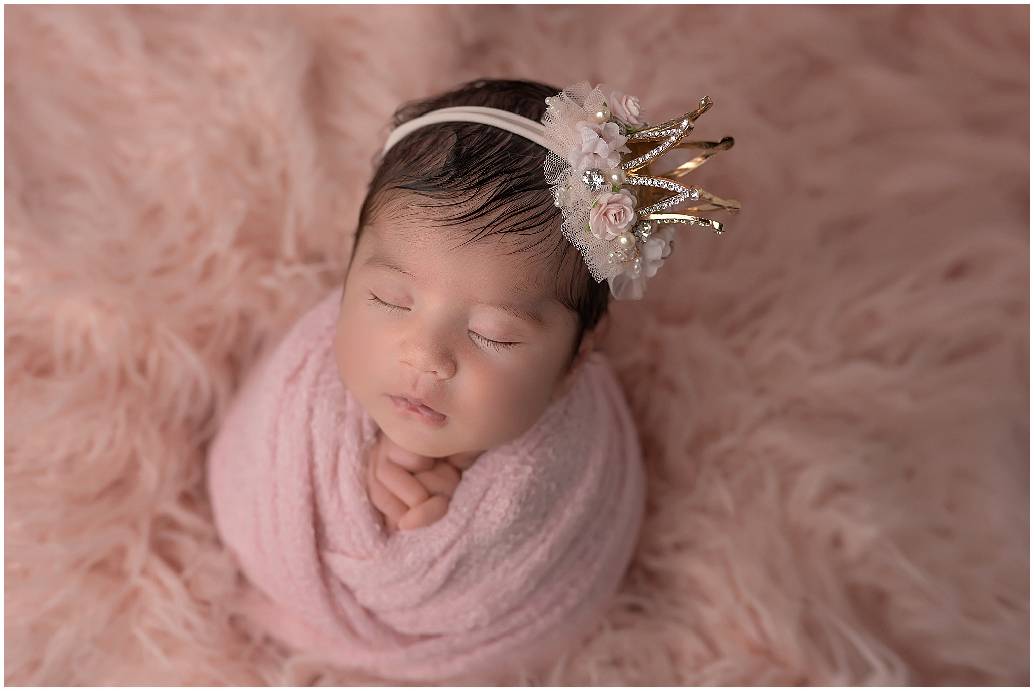 newborn girl in pink during photo session in london ontario