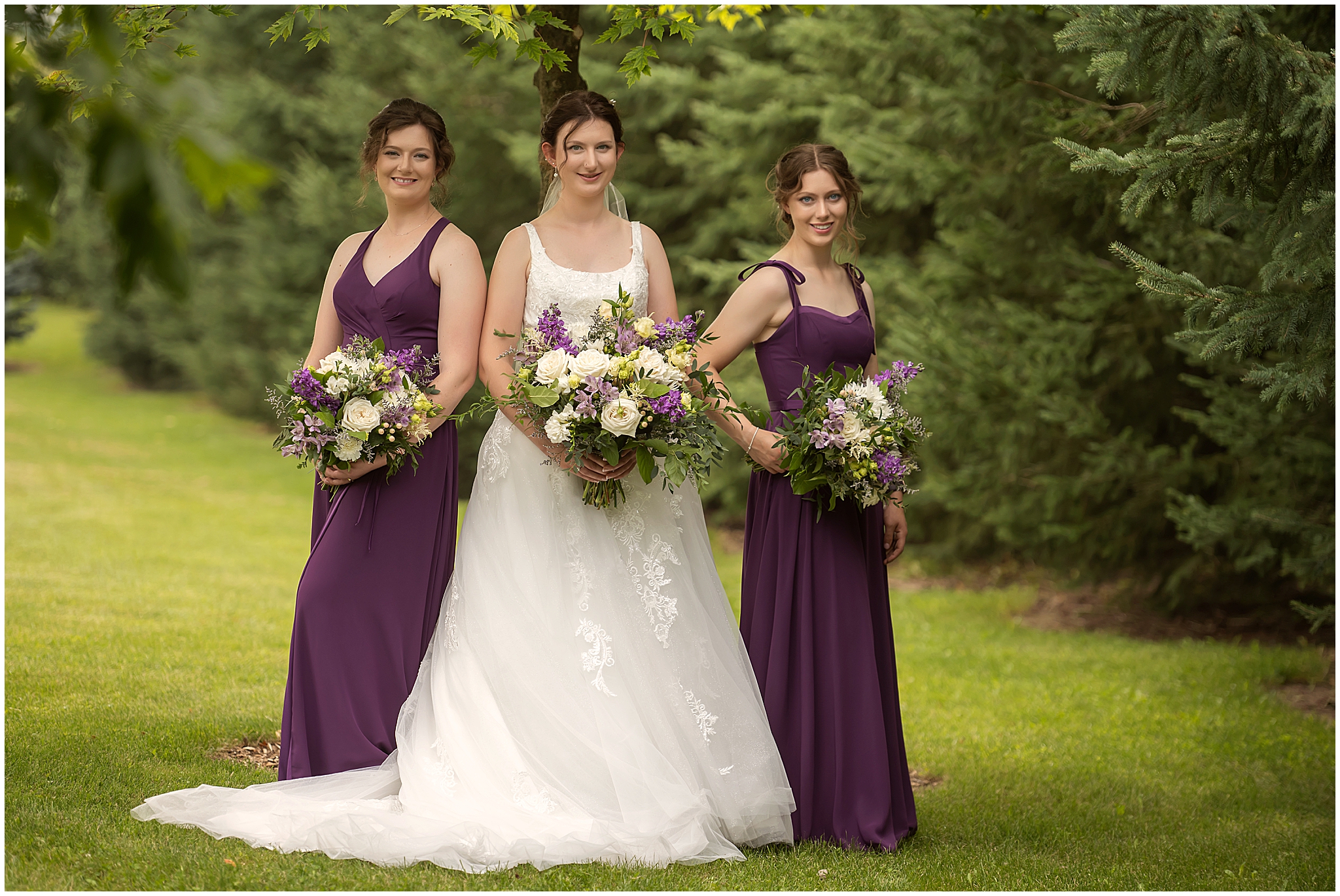 bride and bridesmaids posing for professional wedding photographer in london ontario