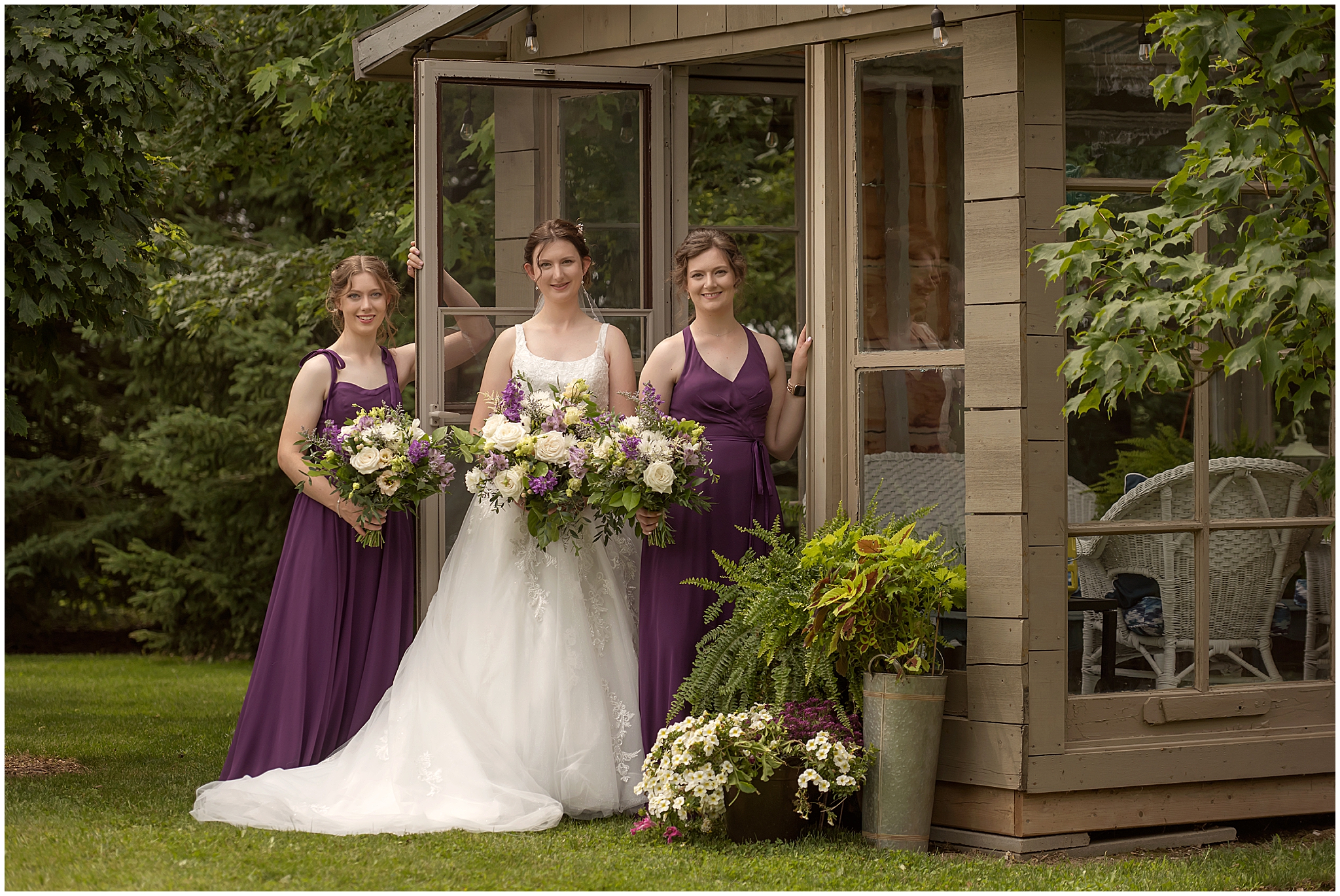 bride and bridesmaids posing for professional wedding photographer in london ontario