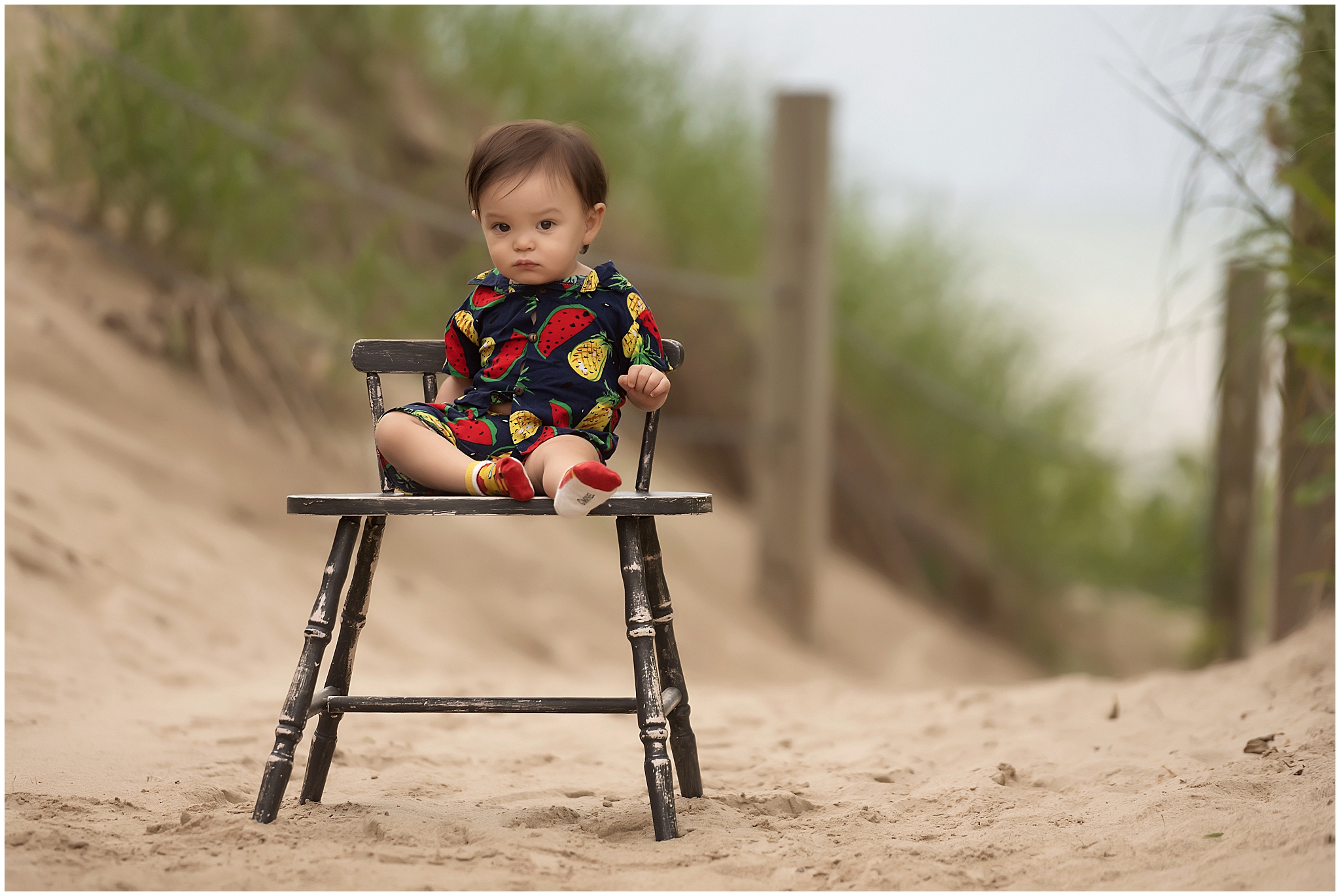 little boy posing on chair for family photography session at port franks beach