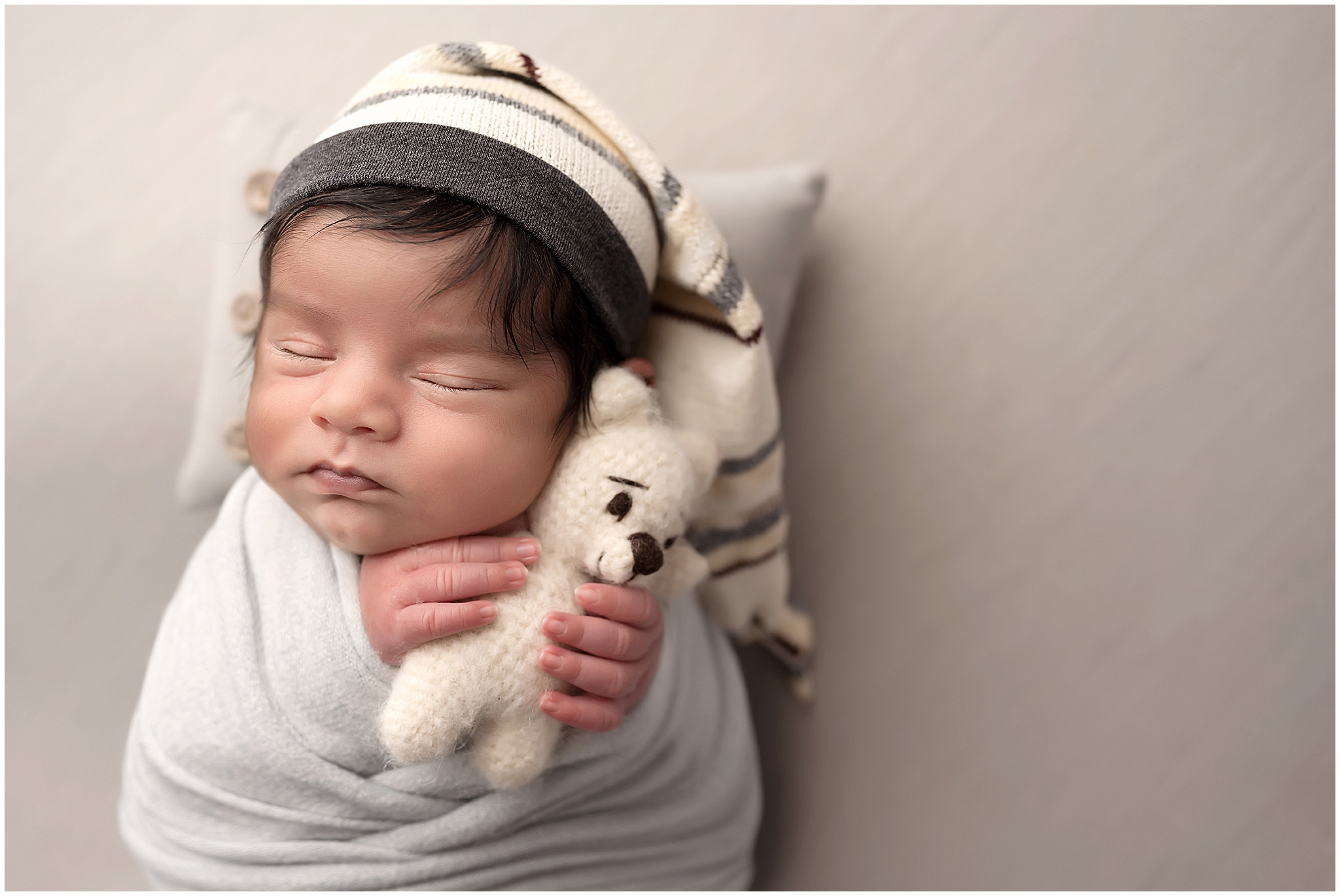 newbon baby boy sleeping with bear during photography session in london omtario