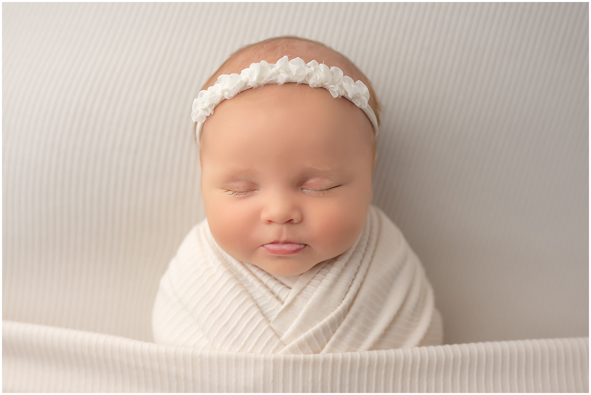baby girl sleeping during newborn photography session in london ontario