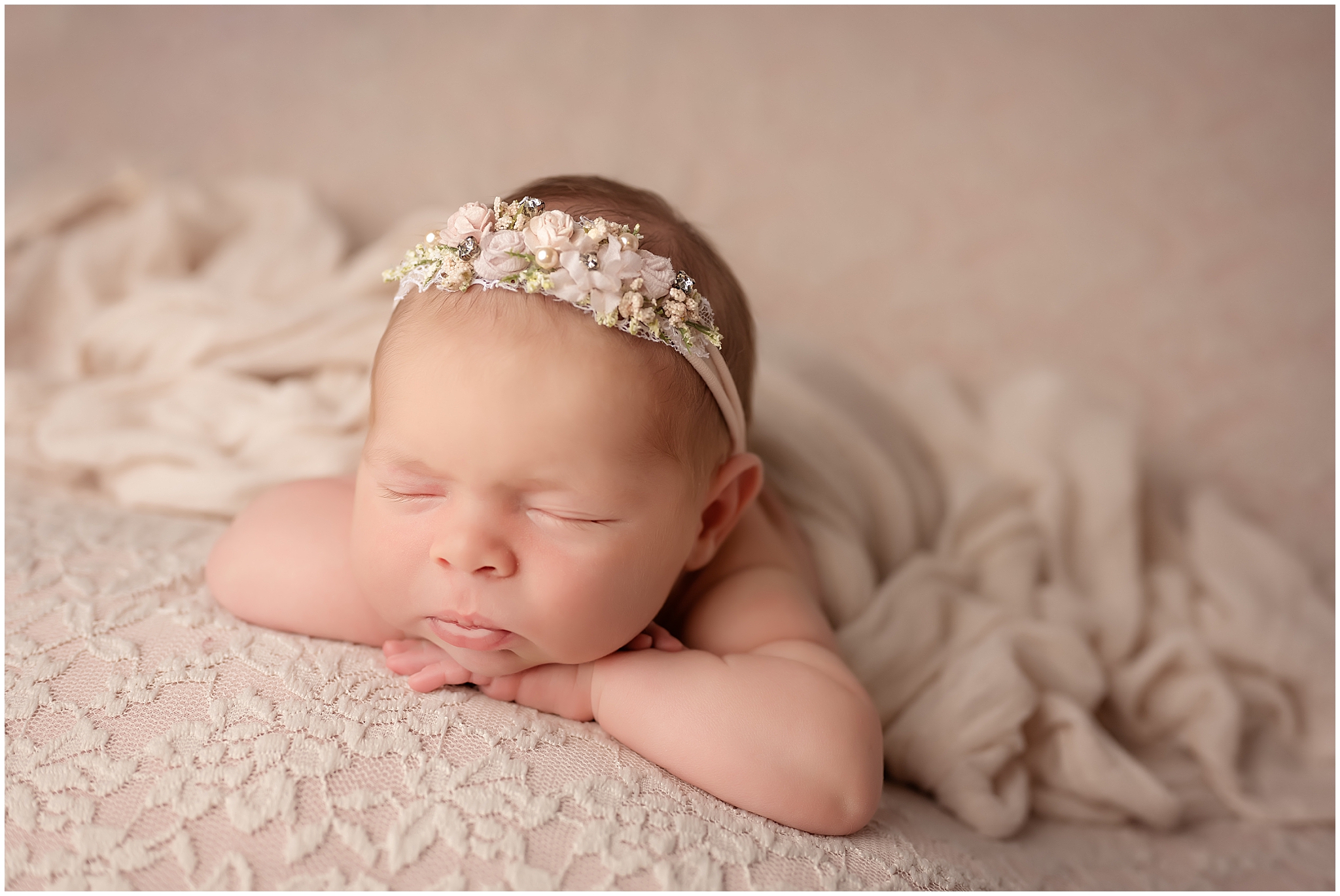 head on hands pose baby sleeping for newborn photographer in london ontario