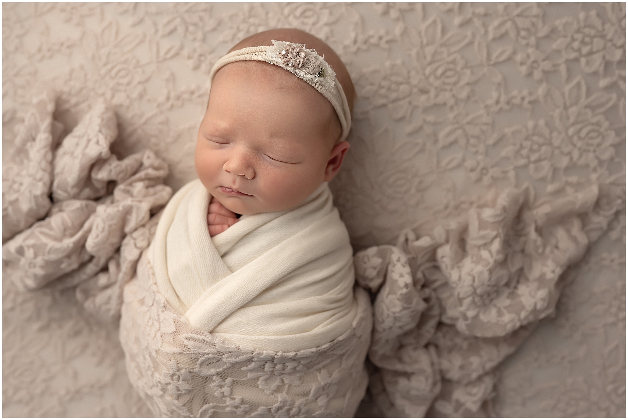 baby girl in neutral setup during newborn session in london ontario