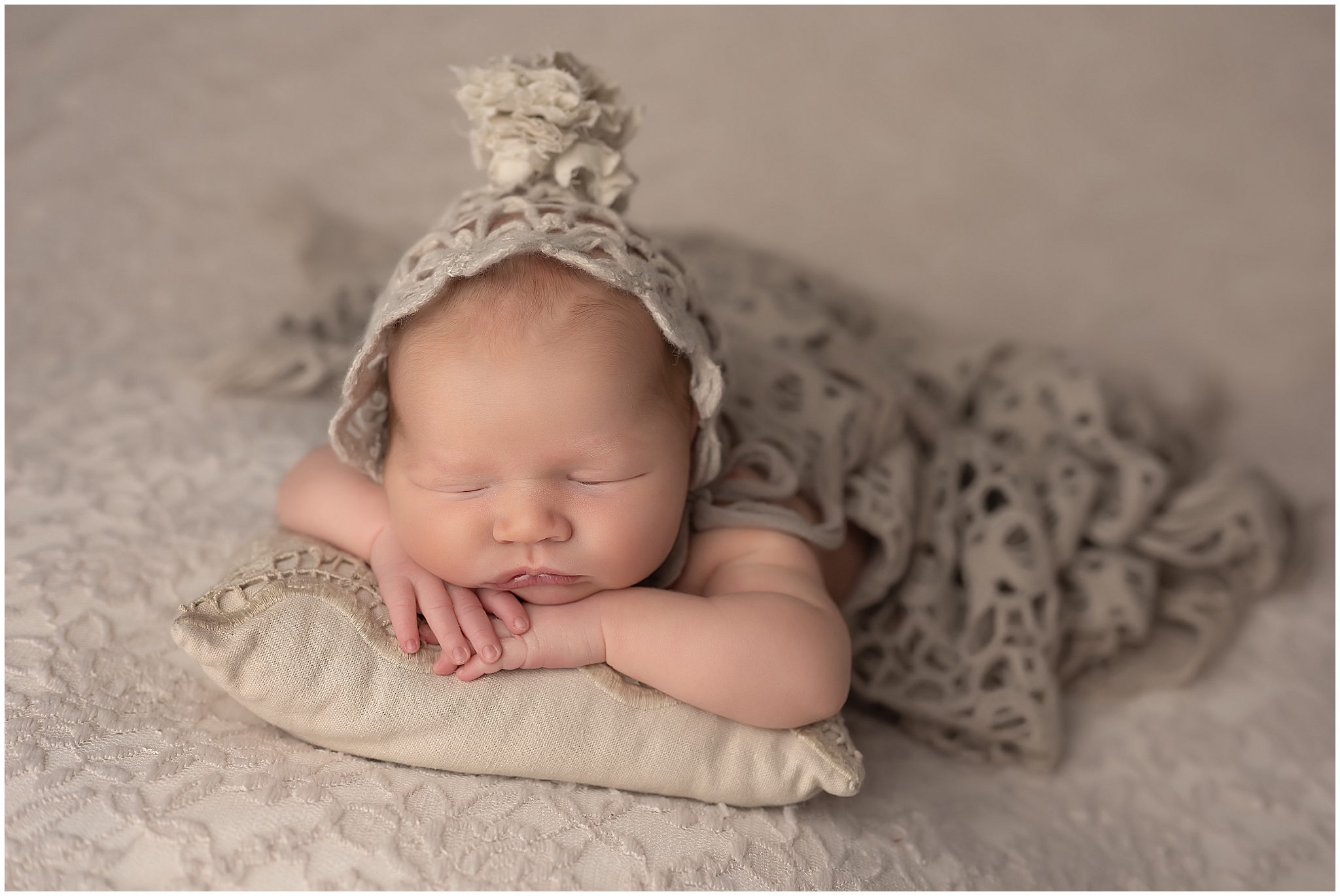 baby girl sleeping with head on hands during newborn session in london ontario