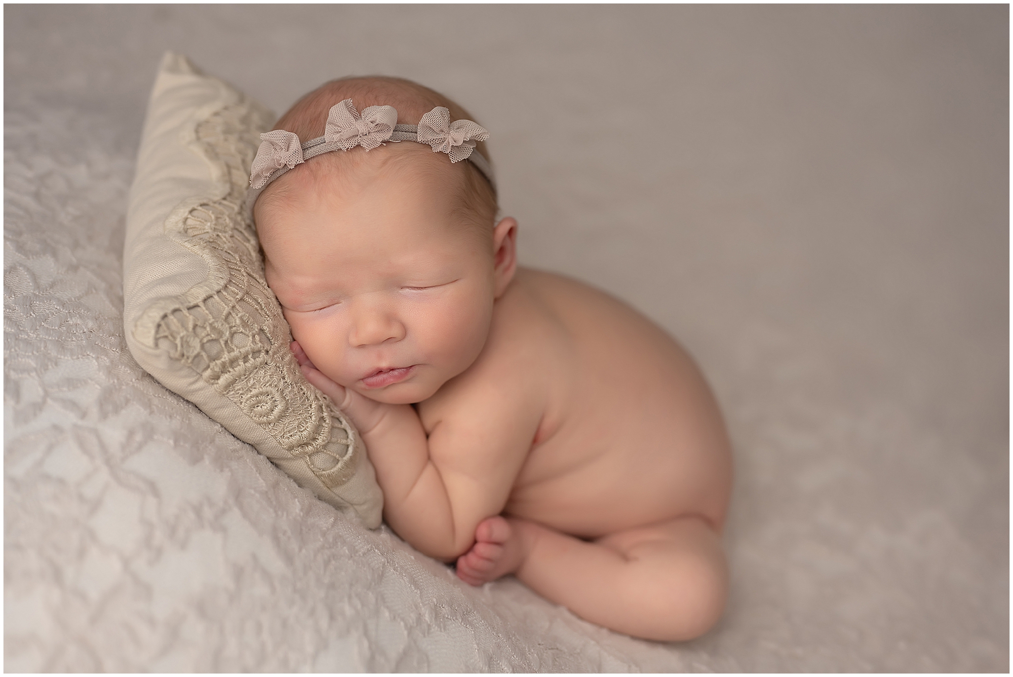 baby in taco pose during newborn session in london ontario