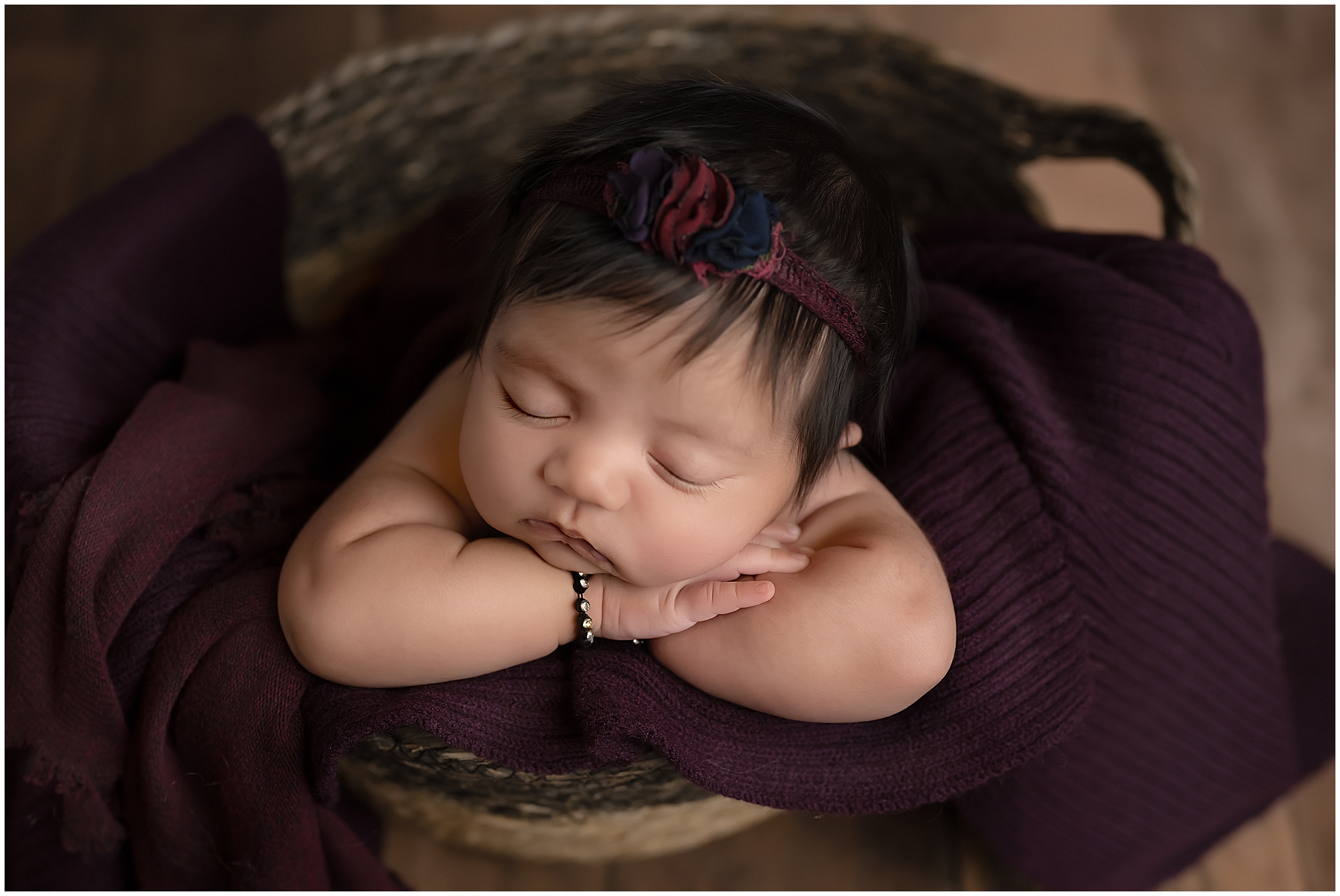 baby sleeping in basket during newborn session in london ontario