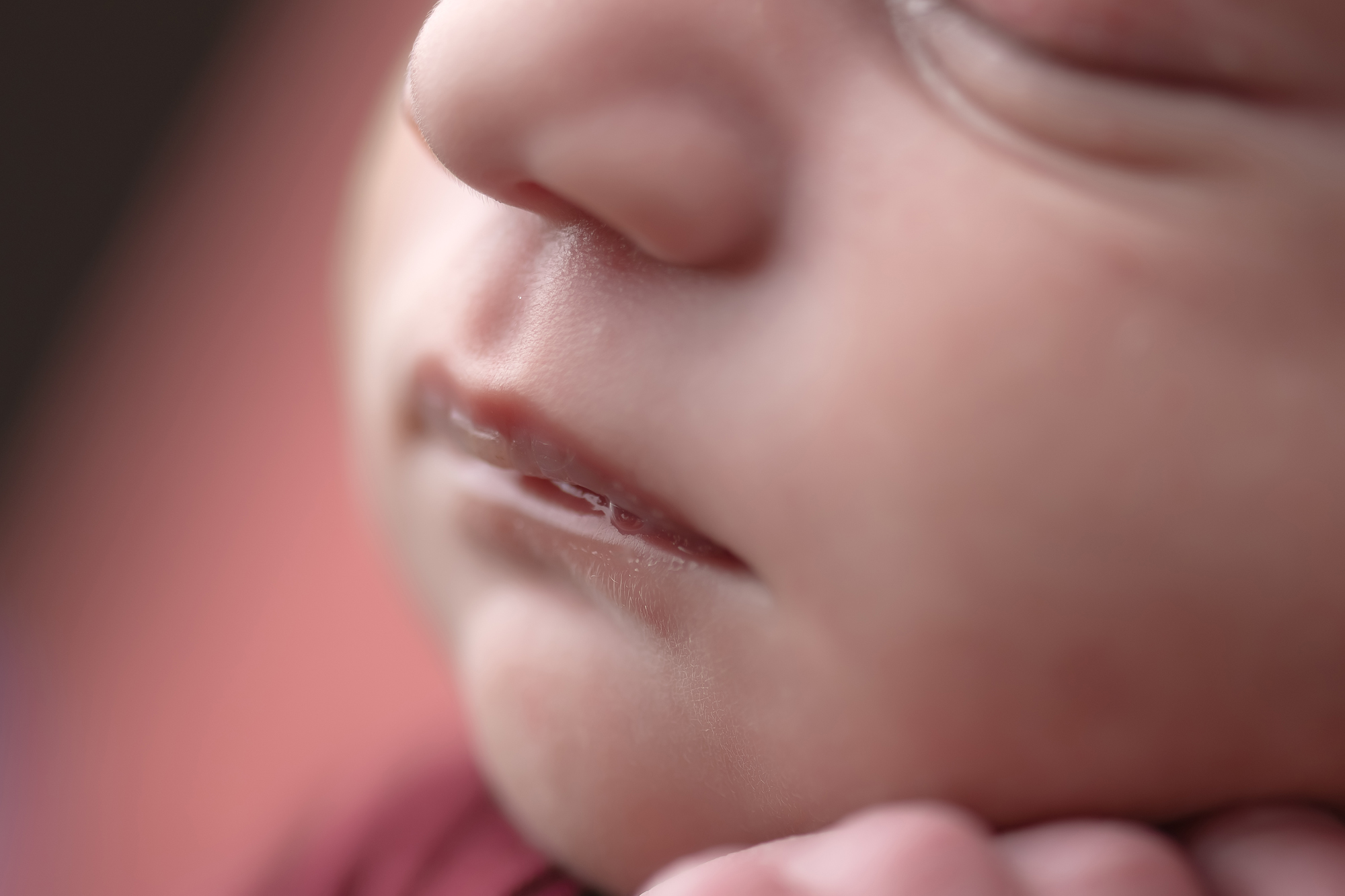 close up of baby face during newborn session in london ontario studio