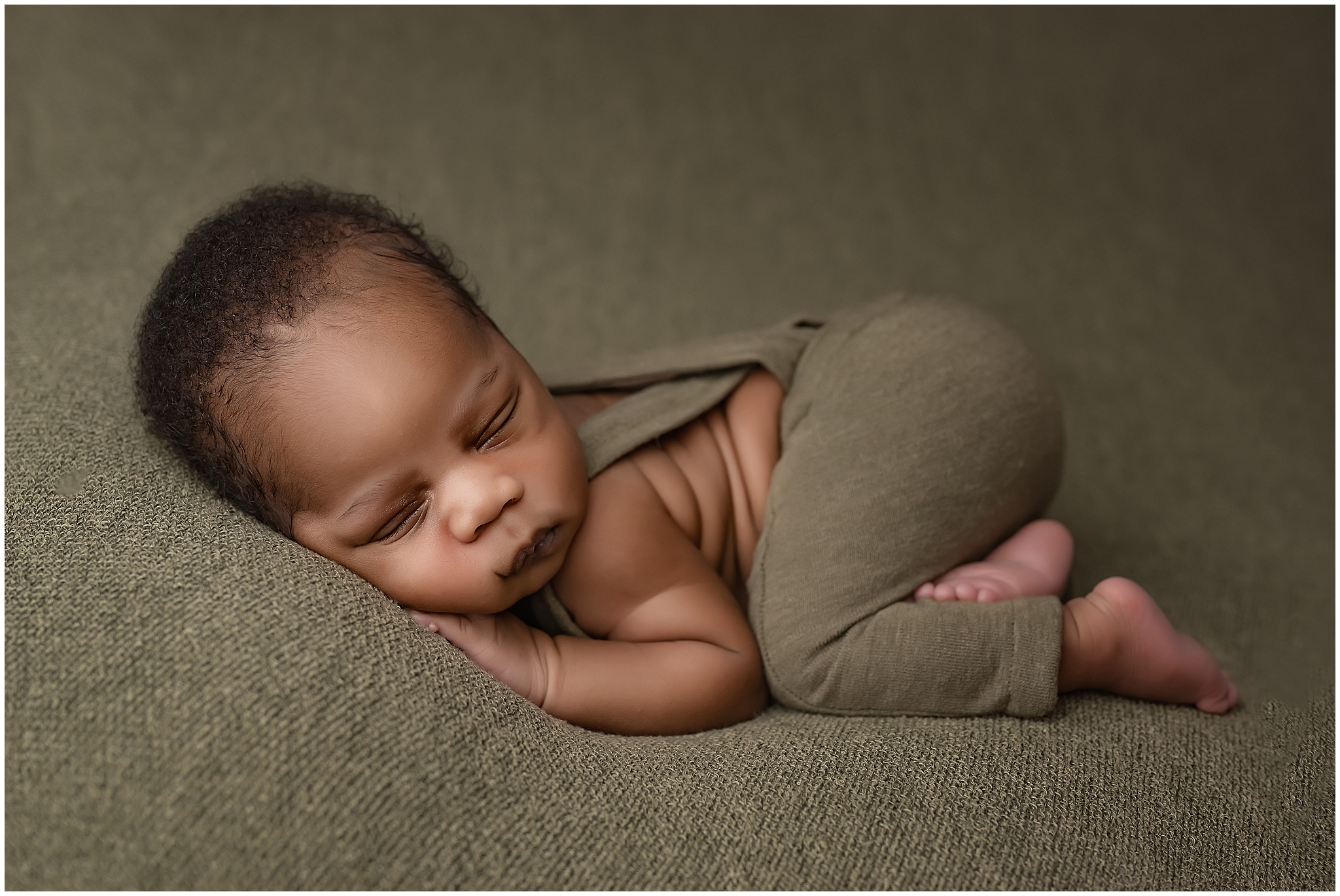 baby in bum up pose during newborn photography session in london ontario