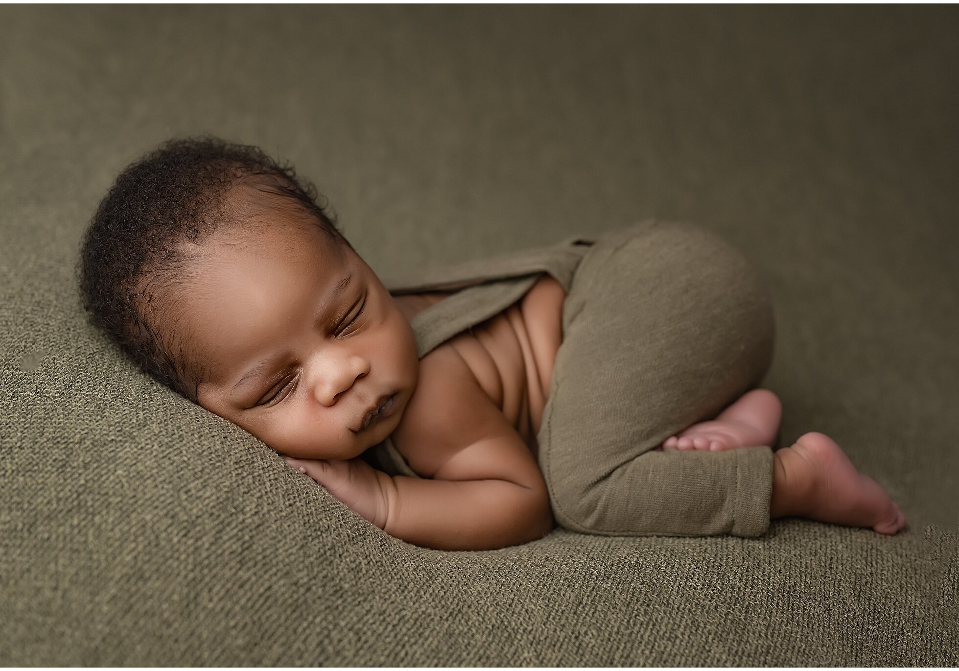 baby in bum up pose during newborn photography session in london ontario